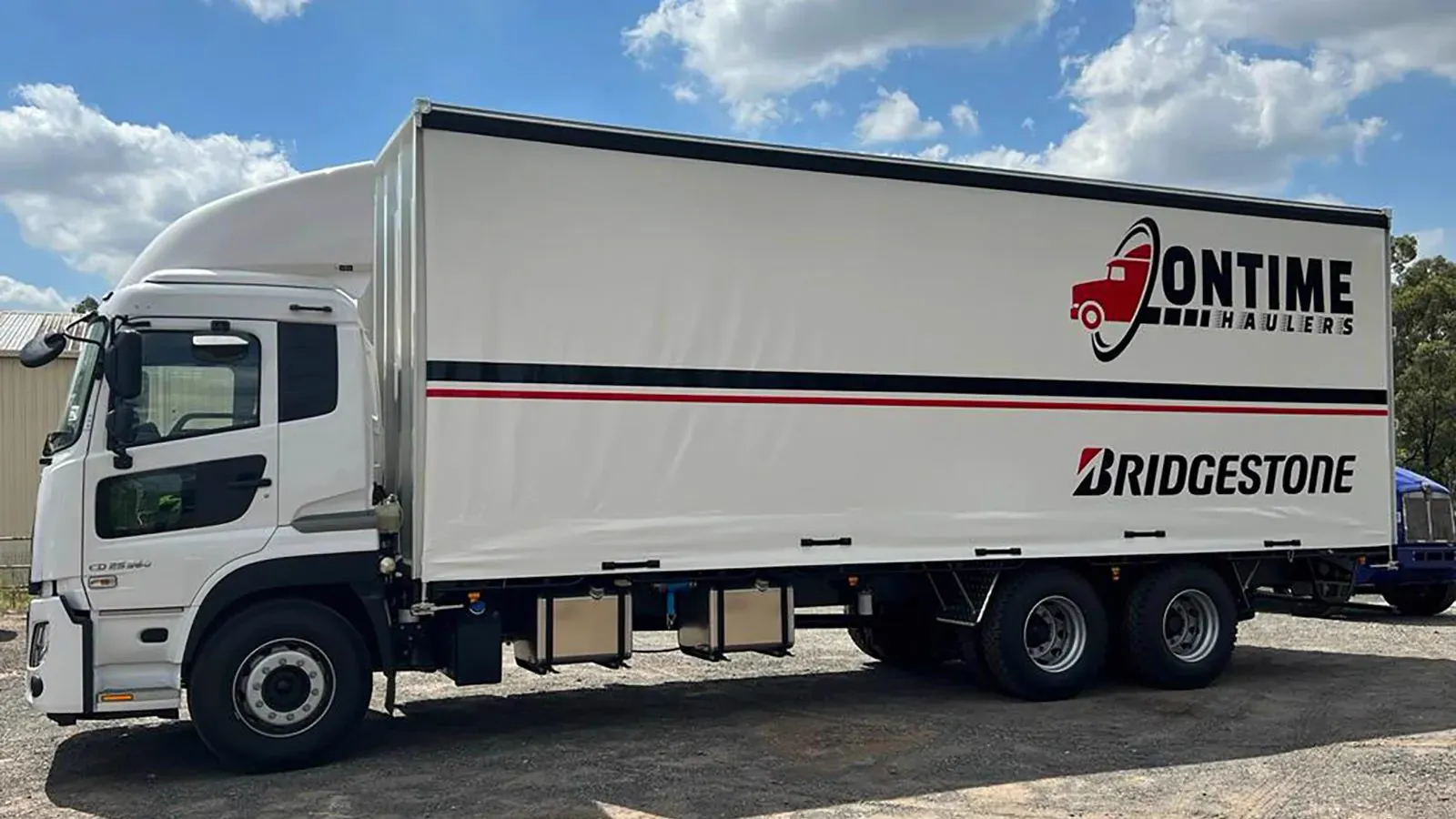 Ontime Haulers 12 tonne 14 pallet tautliner truck delivering pallets across South East Queensland